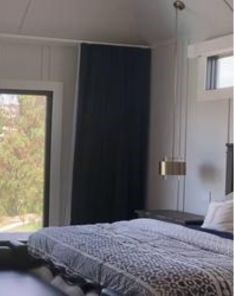 Elegant custom curtains and drapes in a Los Angeles luxury bedroom, showcasing the perfect blend of style and functionality.