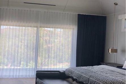 Elegant custom curtains and drapes in a Los Angeles luxury bedroom, showcasing the perfect blend of style and functionality.