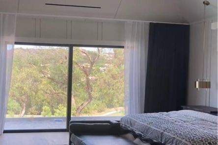 Elegant custom curtains and drapes in a Los Angeles luxury bedroom, showcasing the perfect blend of style and functionality.